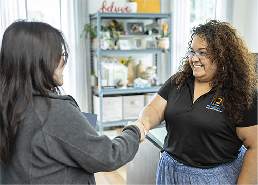 Photo of two people shaking hands