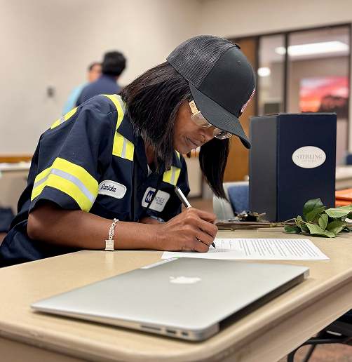Photo of woman completing paperwork.