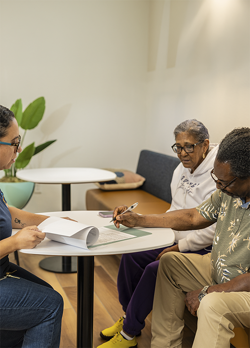 Photo of resident completing paper work.