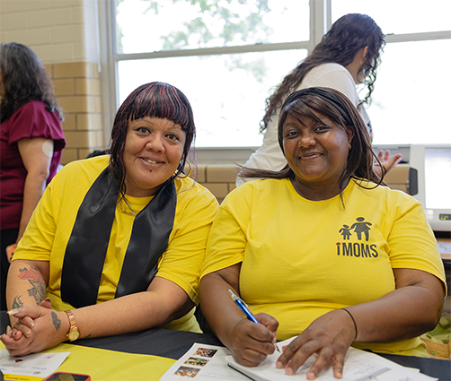 Photo of two residents smiling.