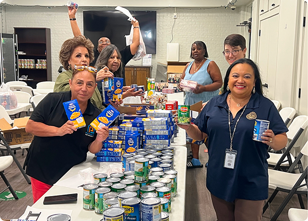 Photo of Austin Housing employees working a food drive.